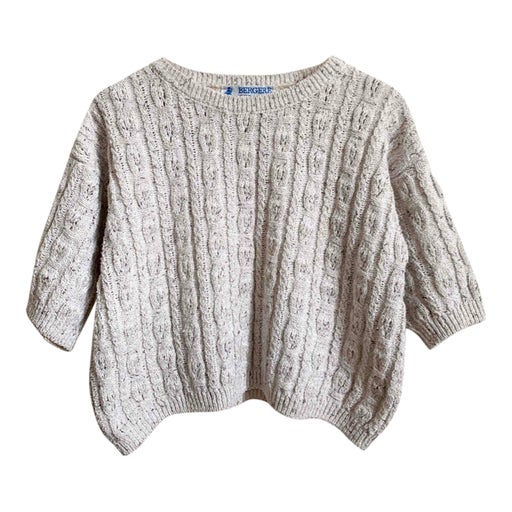 Cropped cable sweater