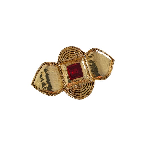 Golden metal brooch