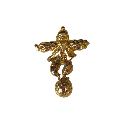 Golden metal brooch