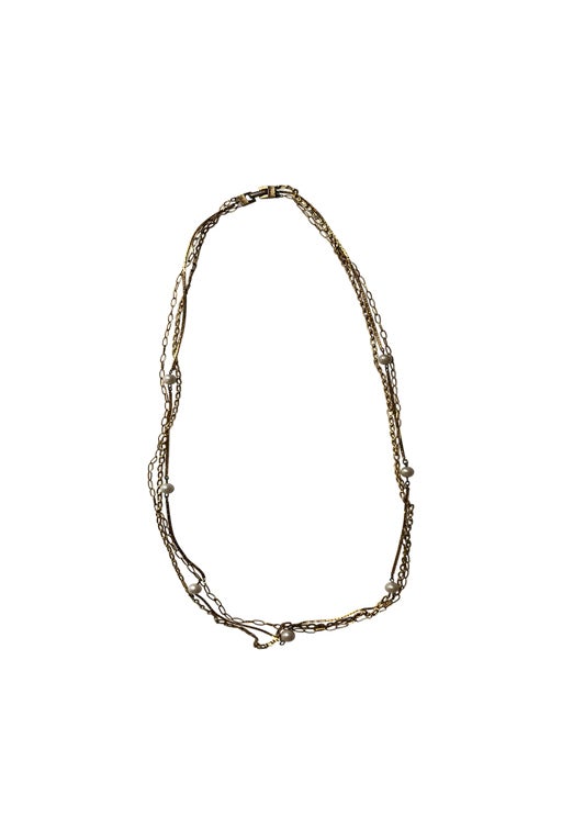 Long necklace in golden metal