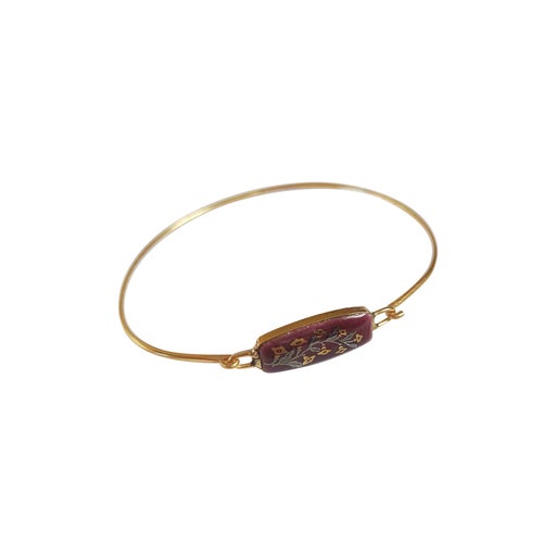 Bangle bracelet in gold metal