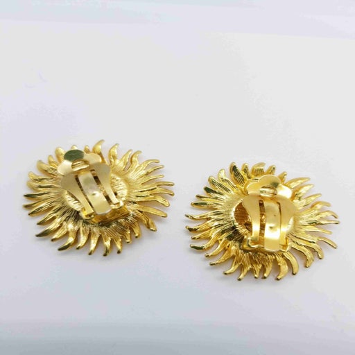 Golden metal earrings