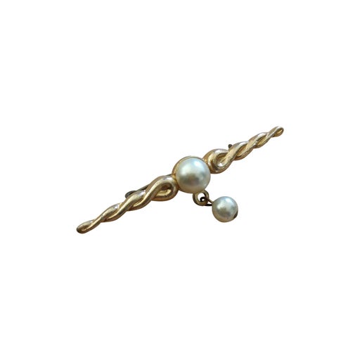 Golden metal brooch