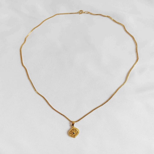 Collier pendentif en métal doré
