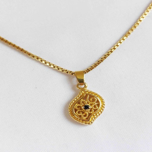 Collier pendentif en métal doré