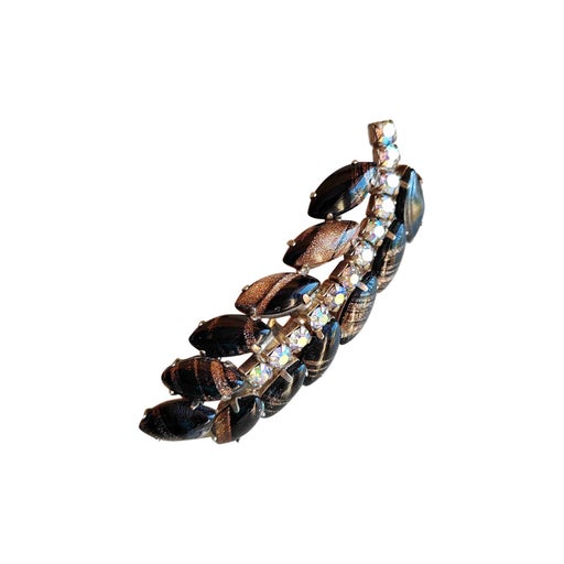 Golden metal brooch