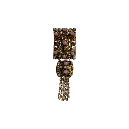 Golden metal brooch
