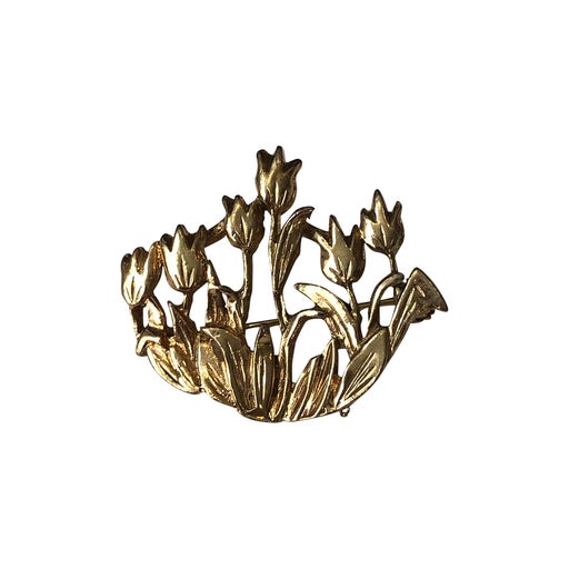 Golden metal brooch