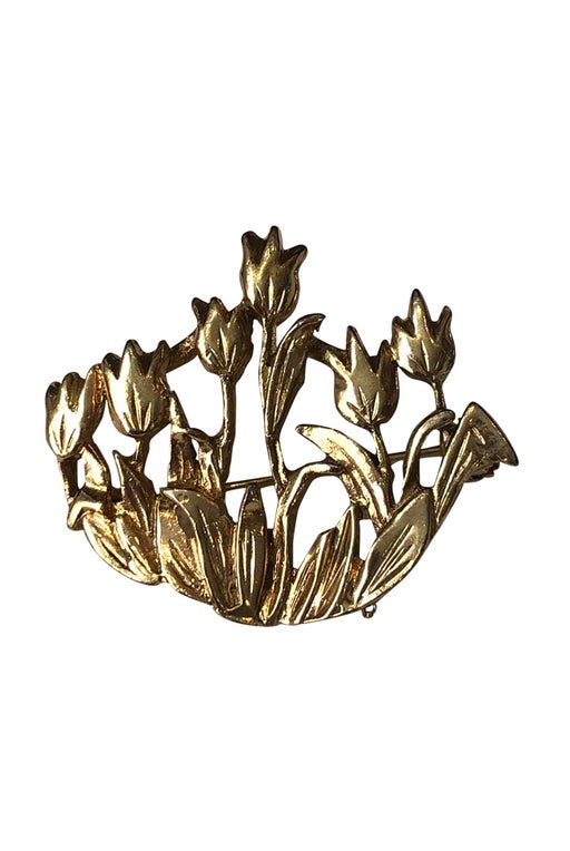 Golden metal brooch