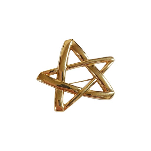 Golden metal brooch
