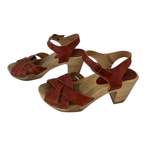 Leather and wood clogs