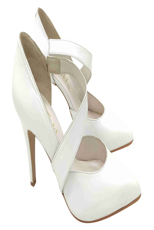 White leather pumps with strap on the