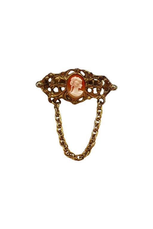 Gold metal brooch